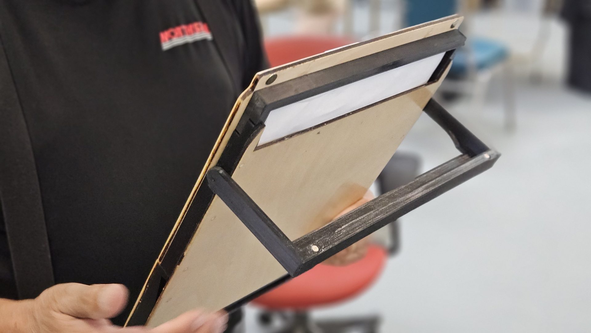 Back of the DeskDrive Pro frame with folding hooks that hang on a steering wheel